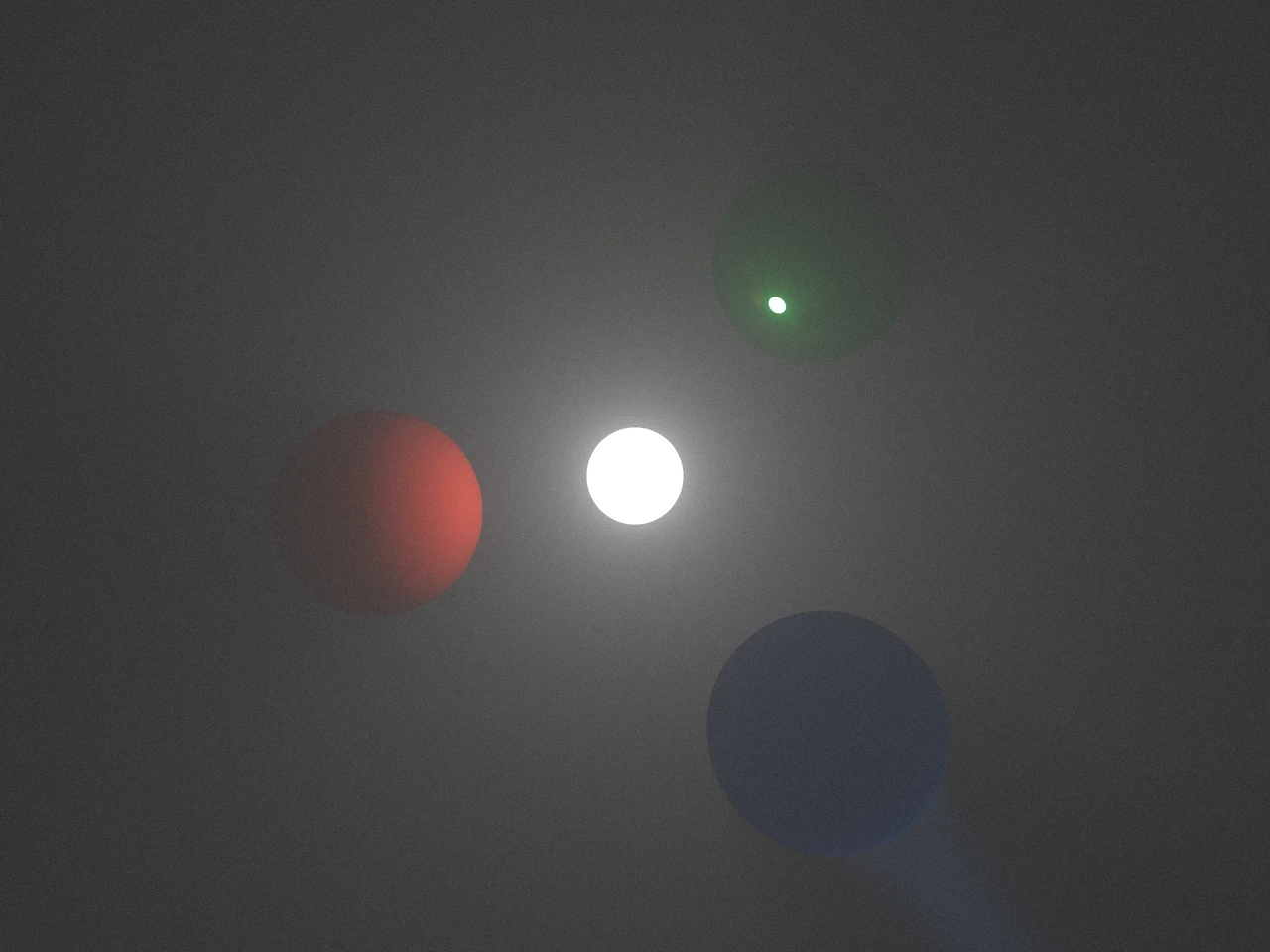 A white emitter lights fog around red diffuse, green reflective and blue refractive spheres against darkness.